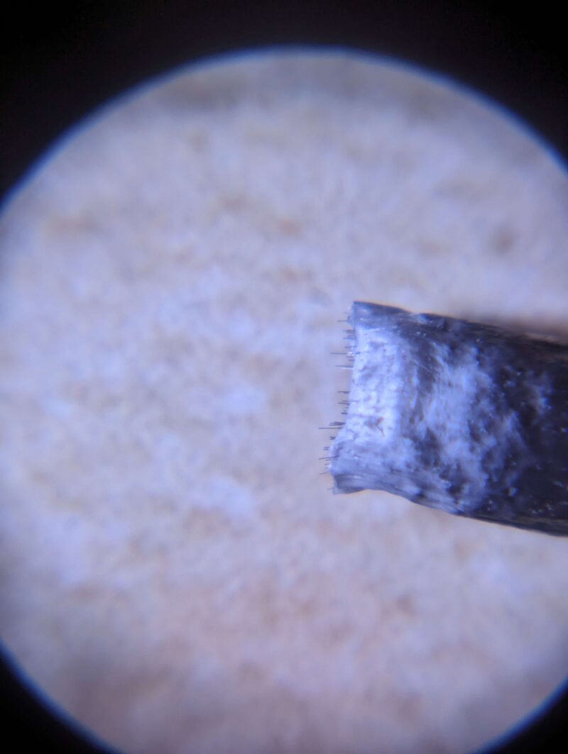 Magnified view of the filament showing long carbon fibres